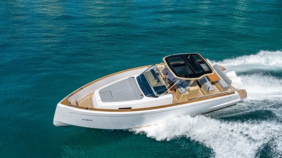 A private BillsIn yacht cruising clear coastal water off Miami