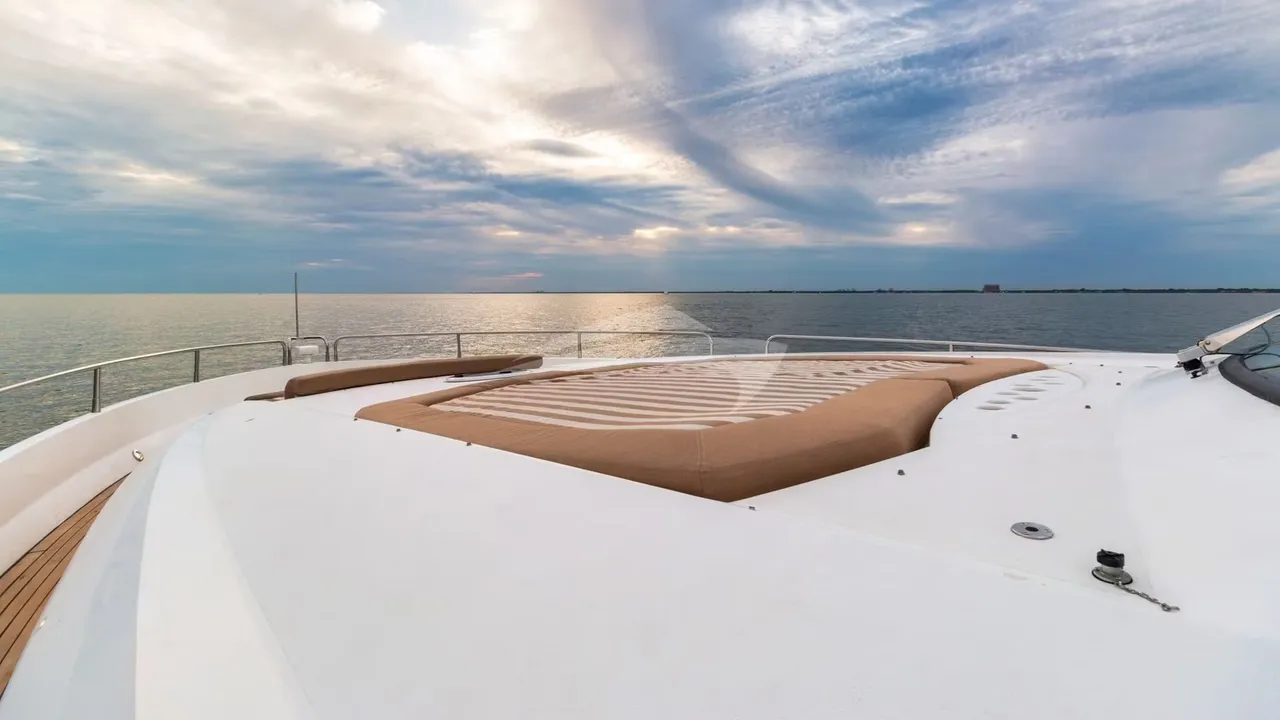 The sun deck of a BillsIn Yachts Miami charter yacht at golden hour